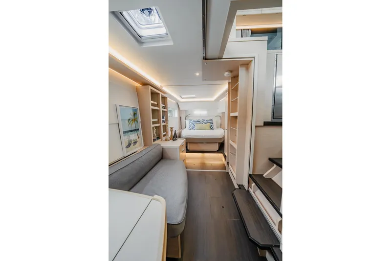 Slide: The Image of Luxurious interior of 2022 Lagoon 46 yacht with modern furnishings and ambient lighting. - 53