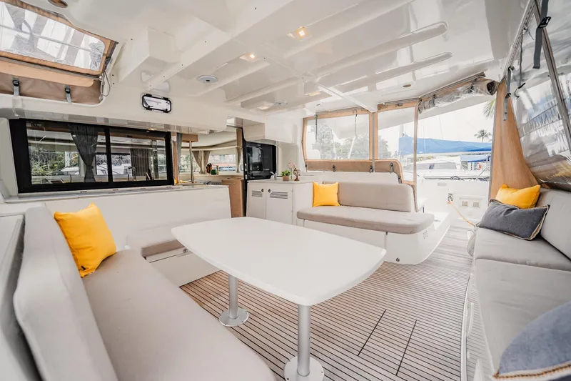 Slide: The Image of Luxurious interior of 2022 Lagoon 46 catamaran with modern seating and bright accents. - 6