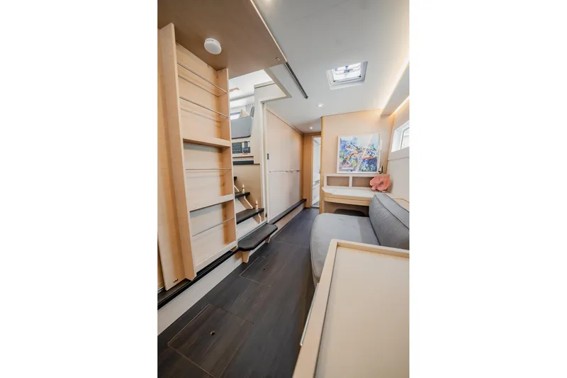 Slide: The Image of Luxurious interior of 2022 Lagoon 46 catamaran with modern design and cozy seating area. - 61