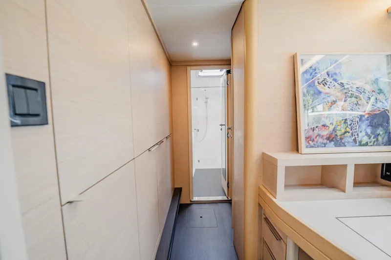 Slide: The Image of Interior of 2022 Lagoon 46 yacht with modern design and turtle artwork. - 62