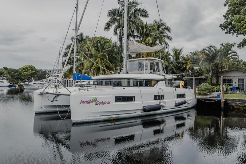 Slide: The Image of 2022 Lagoon 46 catamaran "Jungle Goddess" docked by tropical trees. - 64