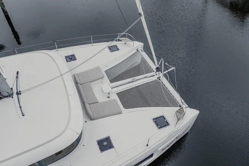 Slide: The Image of Aerial view of 2022 Lagoon 46 catamaran on calm water. - 66