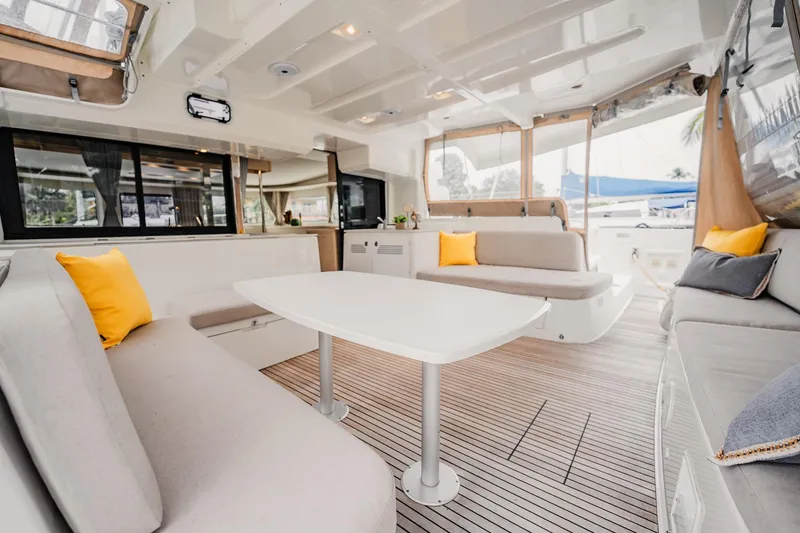 Slide: The Image of Luxurious interior of 2022 Lagoon 46 catamaran with modern seating and decor. - 7
