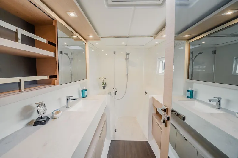 Slide: The Image of Luxurious bathroom interior of 2022 Lagoon 46 yacht, featuring modern fixtures and elegant design. - 74