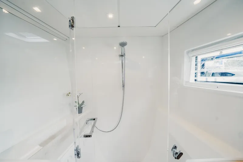 Slide: The Image of Modern shower in 2022 Lagoon 46 yacht, featuring sleek design and natural light. - 76