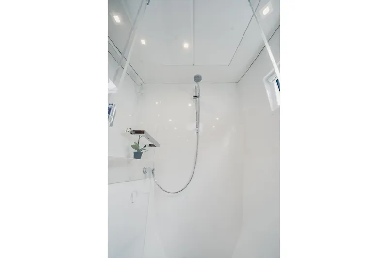 Slide: The Image of Modern shower area in 2022 Lagoon 46 yacht, featuring sleek design and bright lighting. - 78