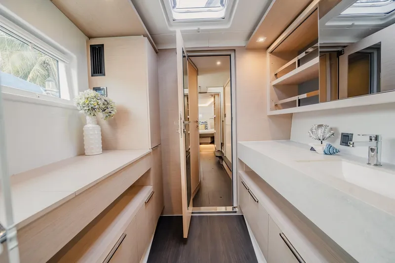 Slide: The Image of Luxurious interior of 2022 Lagoon 46 yacht featuring modern bathroom design and elegant decor. - 79