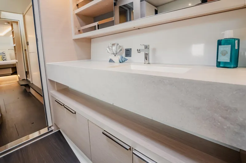 Slide: The Image of Modern bathroom interior of 2022 Lagoon 46 yacht with sleek sink and storage. - 82