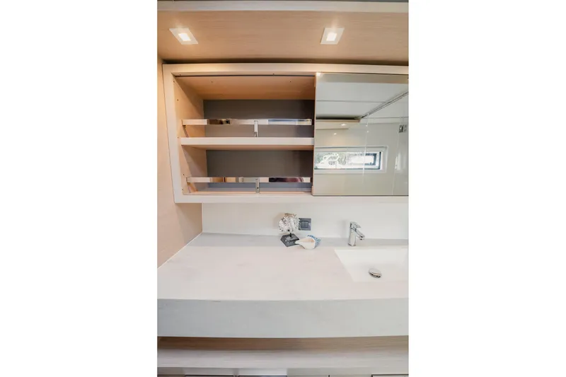 Slide: The Image of Modern bathroom interior of 2022 Lagoon 46 yacht with sleek sink and shelving. - 84