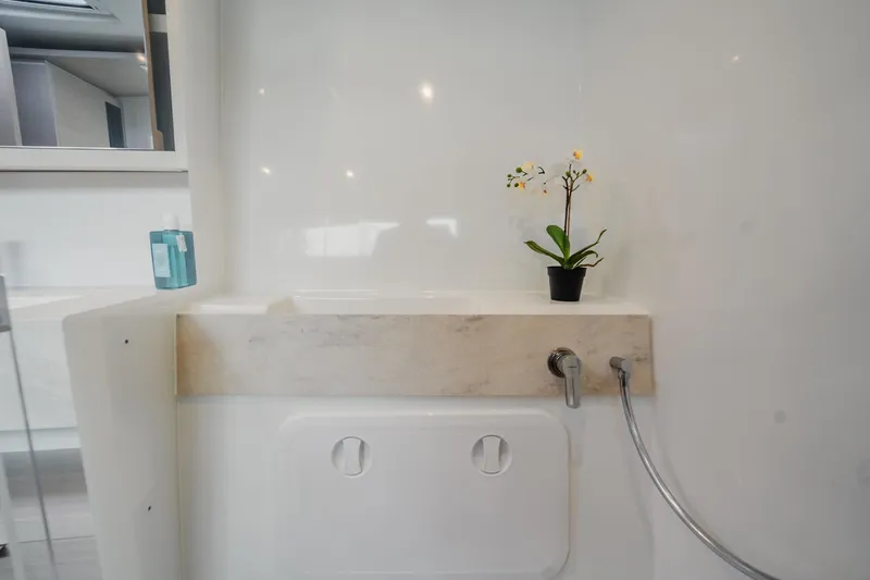 Slide: The Image of Modern bathroom interior of 2022 Lagoon 46 yacht with sleek design and floral decor. - 89