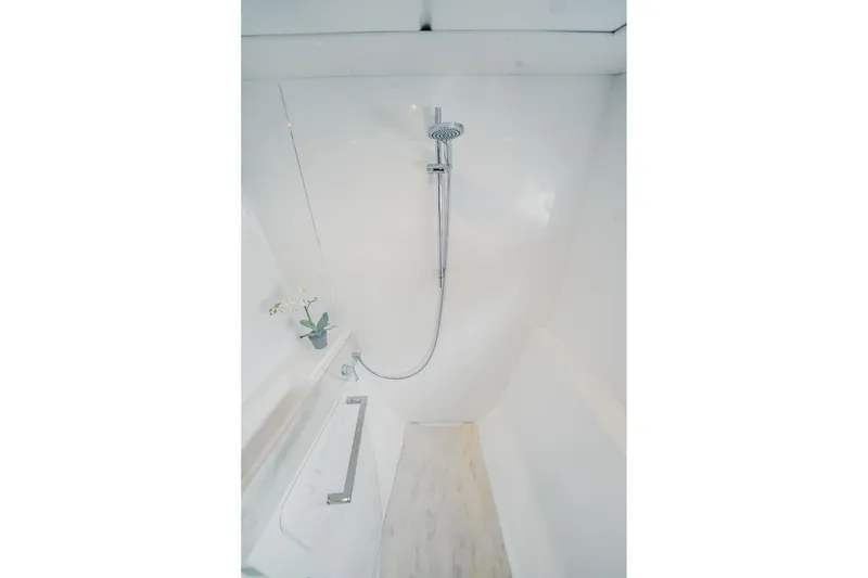 Slide: The Image of Modern shower area in 2022 Lagoon 46 yacht, featuring sleek design and chrome fixtures. - 90