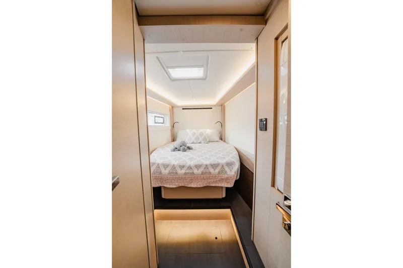 Slide: The Image of Luxurious bedroom interior of 2022 Lagoon 46 yacht with modern design and cozy bedding. - 95