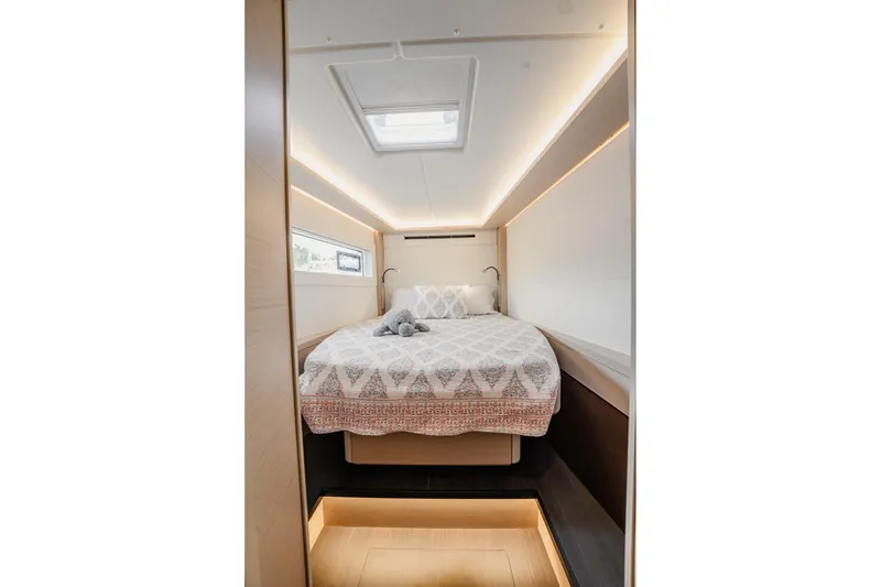 Slide: The Image of Luxurious bedroom interior of 2022 Lagoon 46 yacht with modern design and cozy bedding. - 99