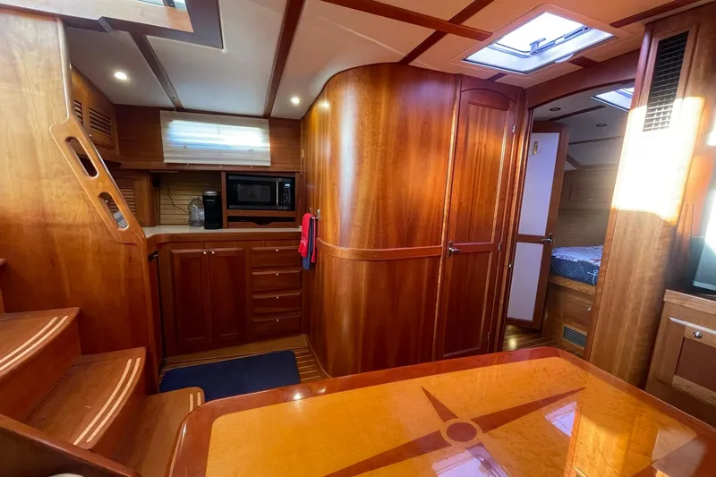 Slide: The Image of Interior of 2008 Sabre 38 Salon Express yacht with wooden cabinetry and modern amenities. - 10
