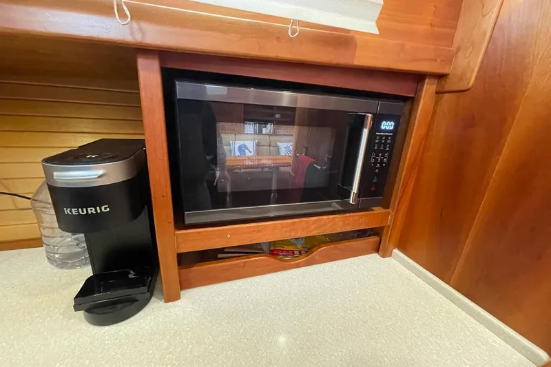 Slide: The Image of Microwave and Keurig coffee maker in 2008 Sabre 38 Salon Express kitchen. - 13