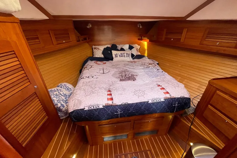 Slide: The Image of Cozy cabin interior of 2008 Sabre 38 Salon Express with nautical-themed bedding. - 15