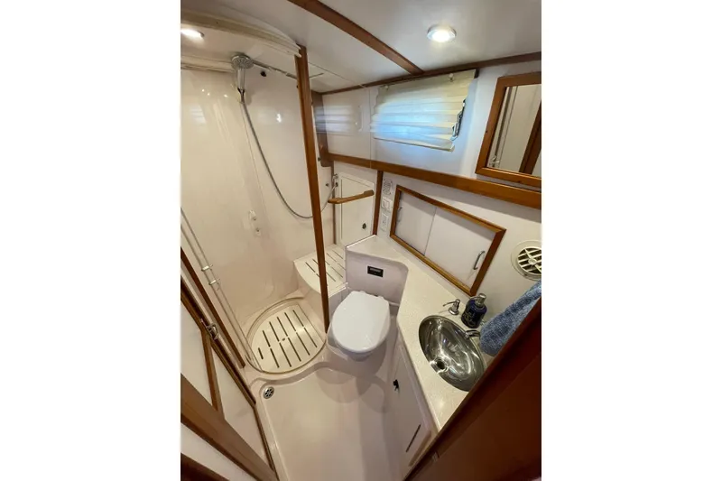 Slide: The Image of 2008 Sabre 38 Salon Express bathroom with shower, sink, and toilet. - 20