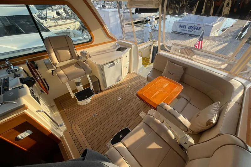 Slide: The Image of Interior of 2008 Sabre 38 Salon Express yacht with seating and helm station. - 30