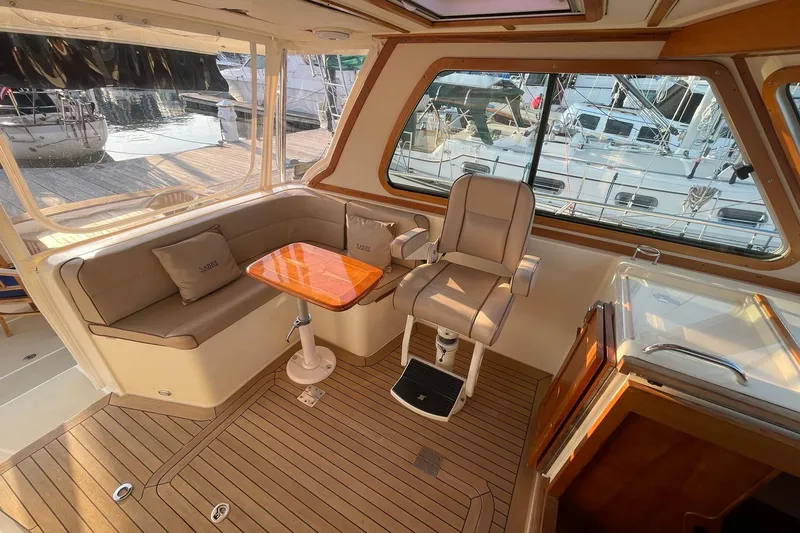 Slide: The Image of Luxurious interior of 2008 Sabre 38 Salon Express yacht with seating and helm. - 31