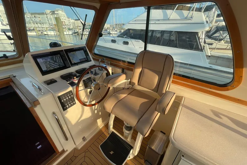 Slide: The Image of Helm of 2008 Sabre 38 Salon Express with navigation screens and captain's chair. - 32