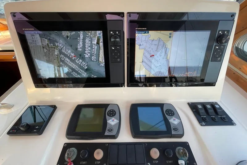 Slide: The Image of Control panel of 2008 Sabre 38 Salon Express with navigation screens and controls. - 35