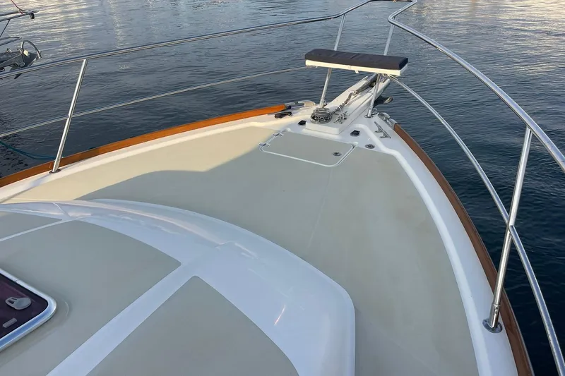 Slide: The Image of 2008 Sabre 38 Salon Express yacht bow with stainless steel railings on calm water. - 60