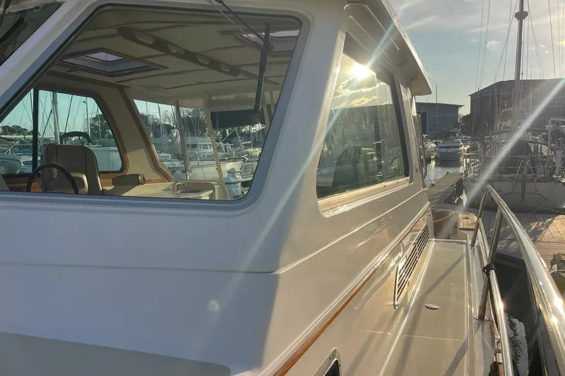 Slide: The Image of 2008 Sabre 38 Salon Express yacht docked at marina, sunlit cabin view. - 64