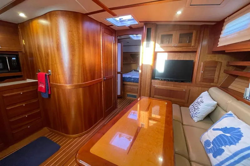 Slide: The Image of Luxurious interior of 2008 Sabre 38 Salon Express yacht with wood finish and cozy seating. - 7