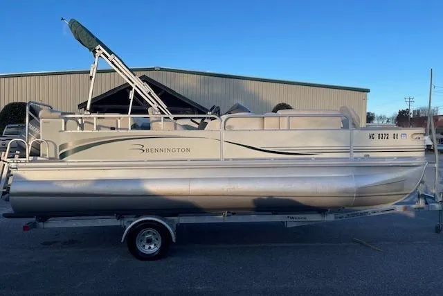 The Image of 2006 Bennington 2075 GS pontoon boat on trailer, parked outdoors. - 1