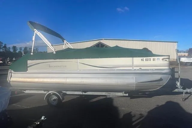 Slide: The Image of 2006 Bennington 2075 GS pontoon boat with green canopy on trailer. - 4