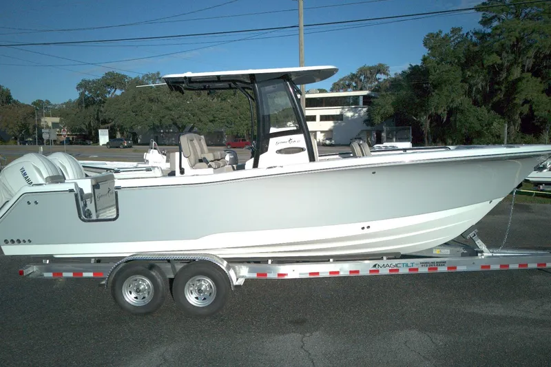 The Image of 2026 Sea Hunt Gamefish 27 Forward Seating boat on trailer, side view. - 1