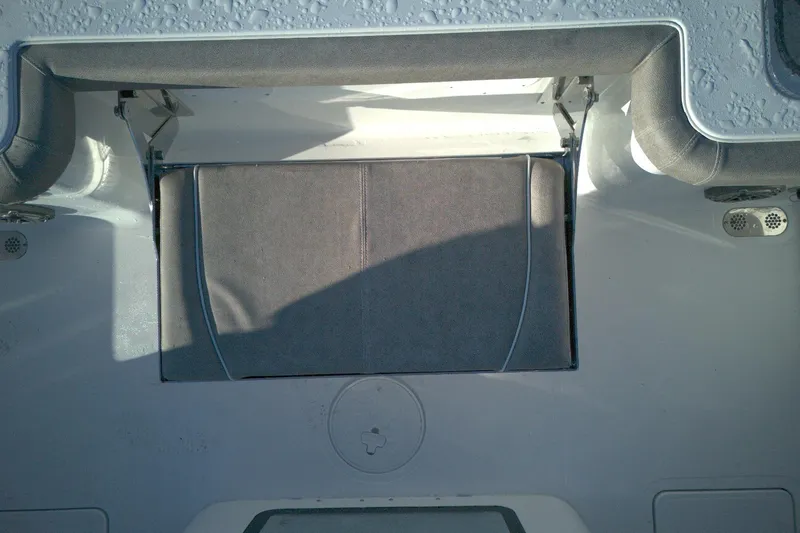 Slide: The Image of 2026 Sea Hunt Gamefish 27 Forward Seating with cushioned storage compartment. - 12