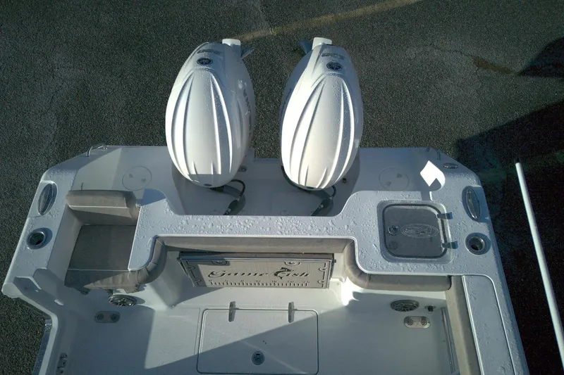 Slide: The Image of 2026 Sea Hunt Gamefish 27 boat with dual engines, forward seating, and sleek design. - 13