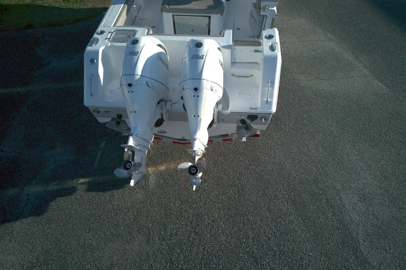 Slide: The Image of 2026 Sea Hunt Gamefish 27 boat with dual outboard engines, rear view. - 16