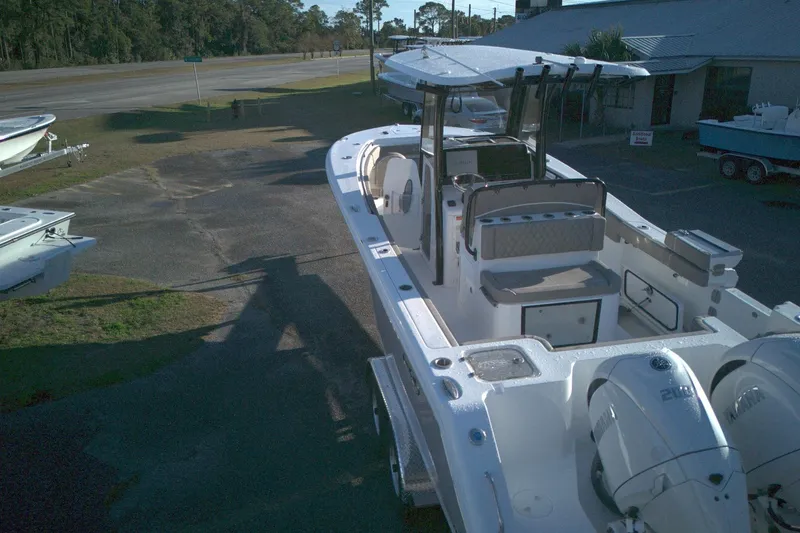 Slide: The Image of 2026 Sea Hunt Gamefish 27 boat with forward seating, parked outdoors. - 7