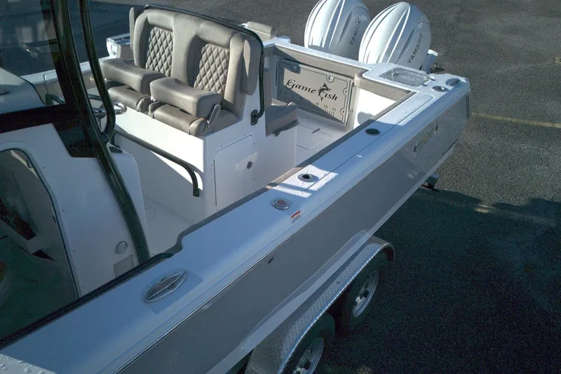 Slide: The Image of 2026 Sea Hunt Gamefish 27 boat with forward seating and dual engines. - 8