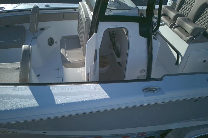 Slide: The Image of 2026 Sea Hunt Gamefish 27 Forward Seating boat interior with seating and storage. - 9
