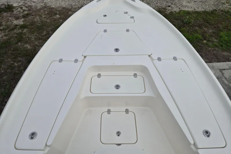 Slide: The Image of 2026 Key West 250 Bay Reef boat deck with multiple storage compartments. - 10