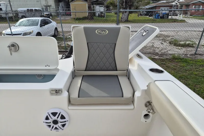 Slide: The Image of 2026 Key West 250 Bay Reef boat seat with storage and speaker. - 14
