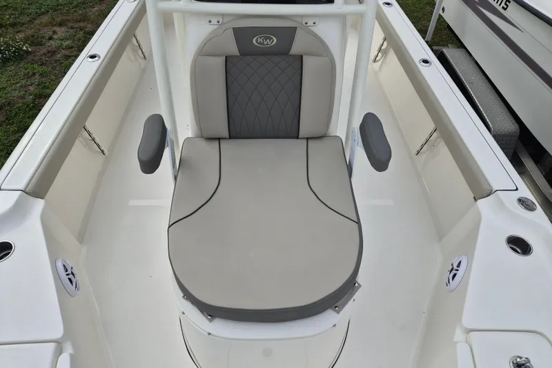 Slide: The Image of 2026 Key West 250 Bay Reef boat seat with gray cushion and armrests. - 5