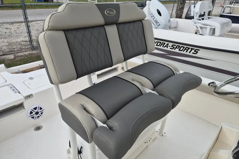 Slide: The Image of 2026 Key West 250 Bay Reef boat seating with gray and beige upholstery. - 7
