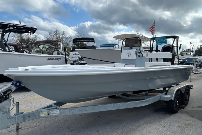 The Image of 2026 Piranha F2000 boat on trailer, parked in a marina with other boats. - 0