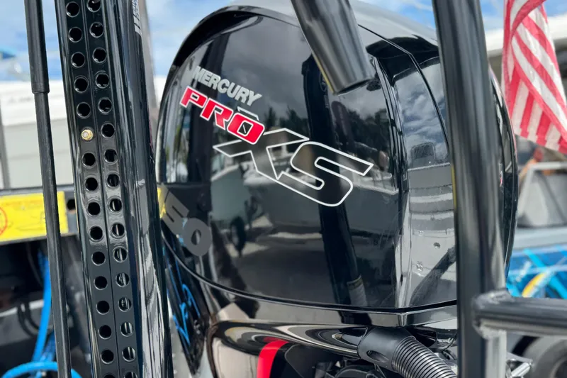 Slide: The Image of Mercury Pro XS engine on Piranha B2000, 2026 model, with American flag in background. - 8