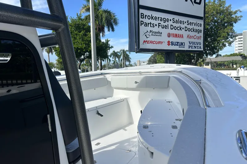 Slide: The Image of 2026 Sea Pro 222 Center Console boat at dealership with service signage. - 19