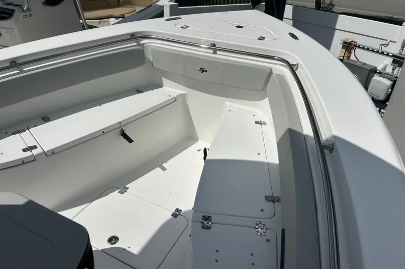 Slide: The Image of 2026 Sea Pro 222 Center Console boat interior with seating and storage compartments. - 24