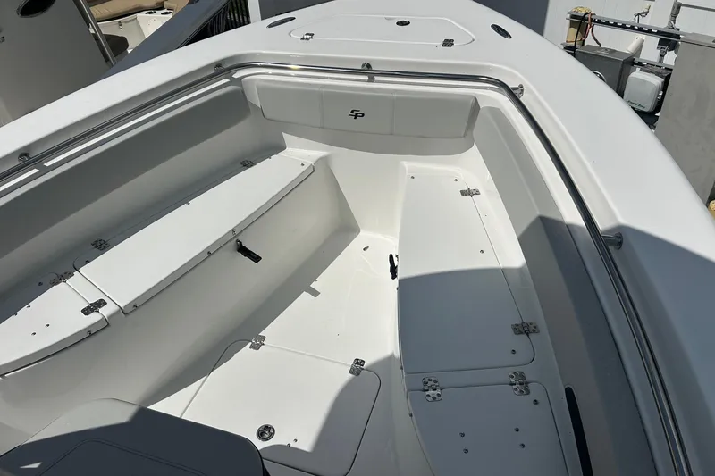 Slide: The Image of 2026 Sea Pro 222 Center Console boat interior with seating and storage compartments. - 25