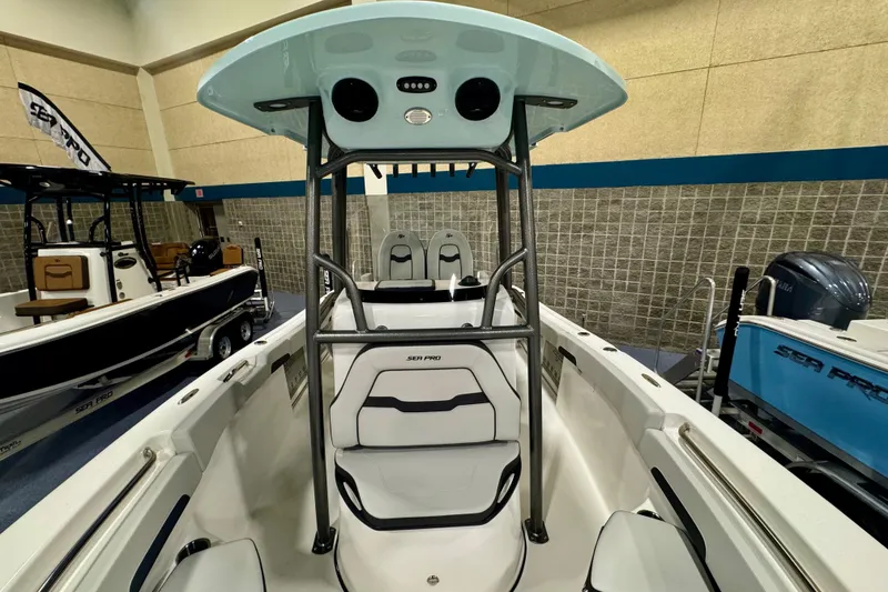 Slide: The Image of 2026 Sea Pro 222 Center Console boat interior with seating and console display. - 27