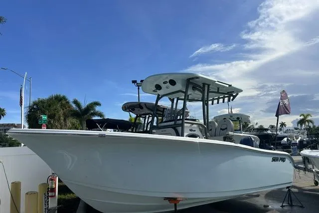 Slide: The Image of 2026 Sea Pro 222 Center Console boat displayed outdoors under a clear sky. - 41
