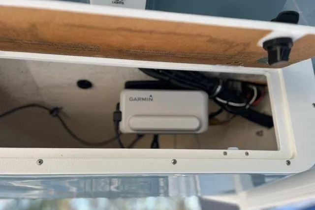 Slide: The Image of 2023 Sea Hunt Ultra 234 boat compartment with Garmin device installed. - 20
