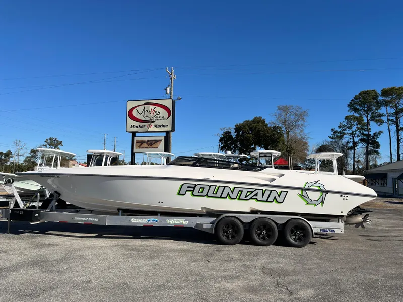 The Image of 2007 Fountain 35 Lightning boat on trailer in front of store. - 0